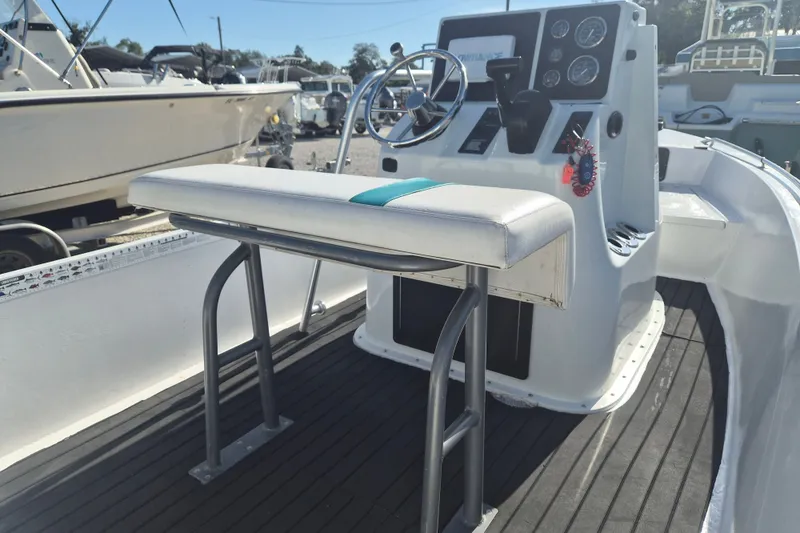 Slide: The Image of 1992 Key West 1720 Center Console boat interior with steering wheel and seating. - 7