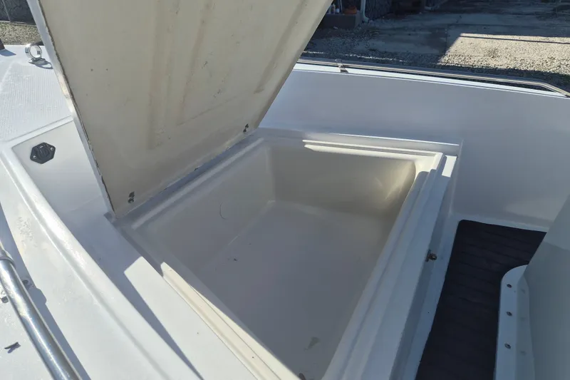 Slide: The Image of Open storage compartment on a 1992 Key West 1720 Center Console boat. - 15
