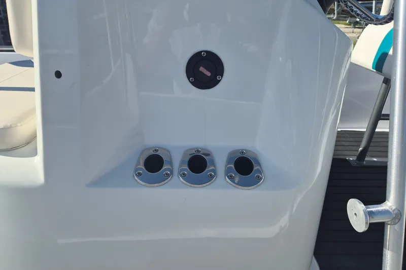 Slide: The Image of 1992 Key West 1720 Center Console boat dashboard with rod holders and control panel. - 12
