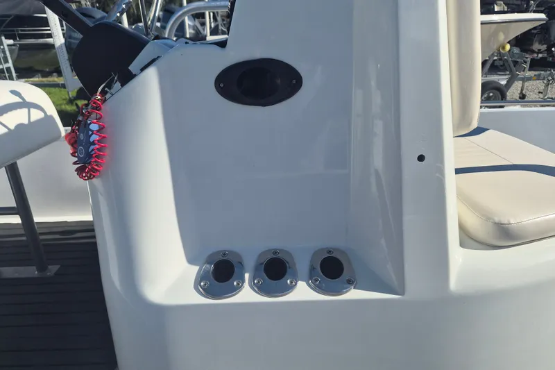 Slide: The Image of 1992 Key West 1720 Center Console boat interior with rod holders and seating. - 11