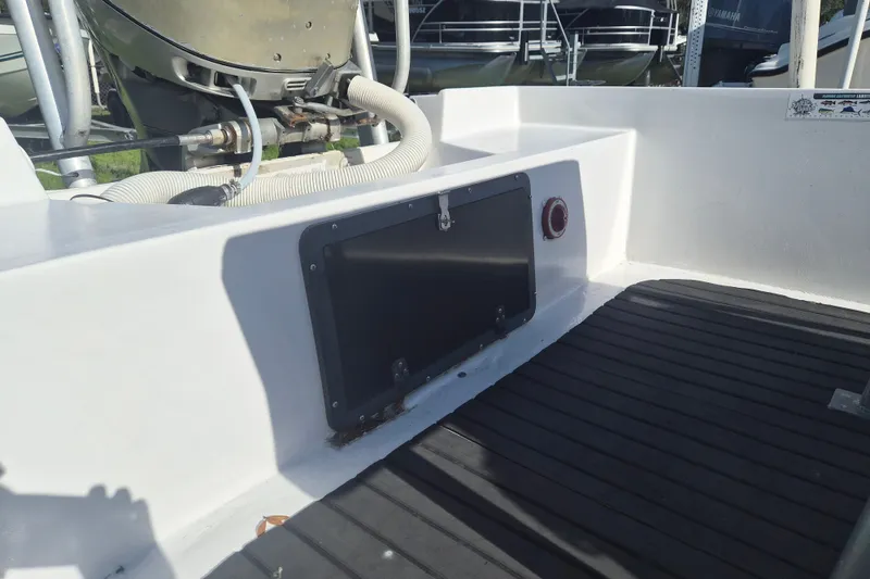 Slide: The Image of 1992 Key West 1720 Center Console boat interior with engine and deck details. - 5