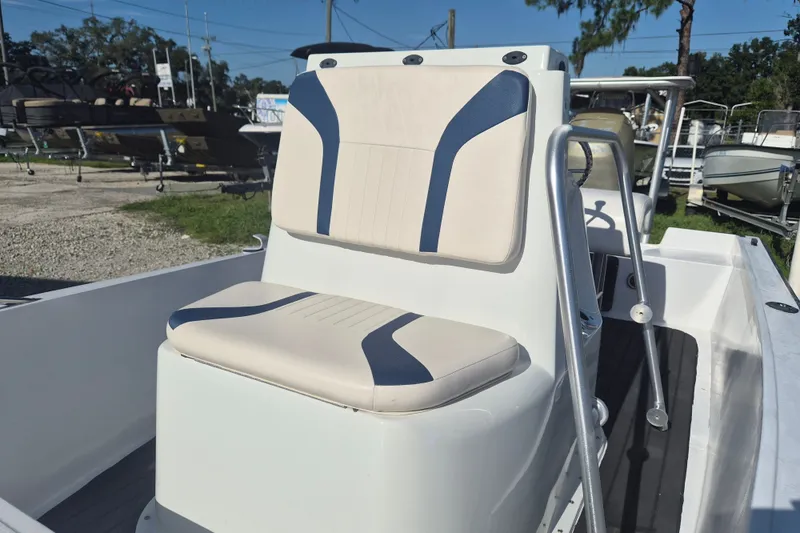 Slide: The Image of 1992 Key West 1720 Center Console boat with cushioned seating and steering console. - 13