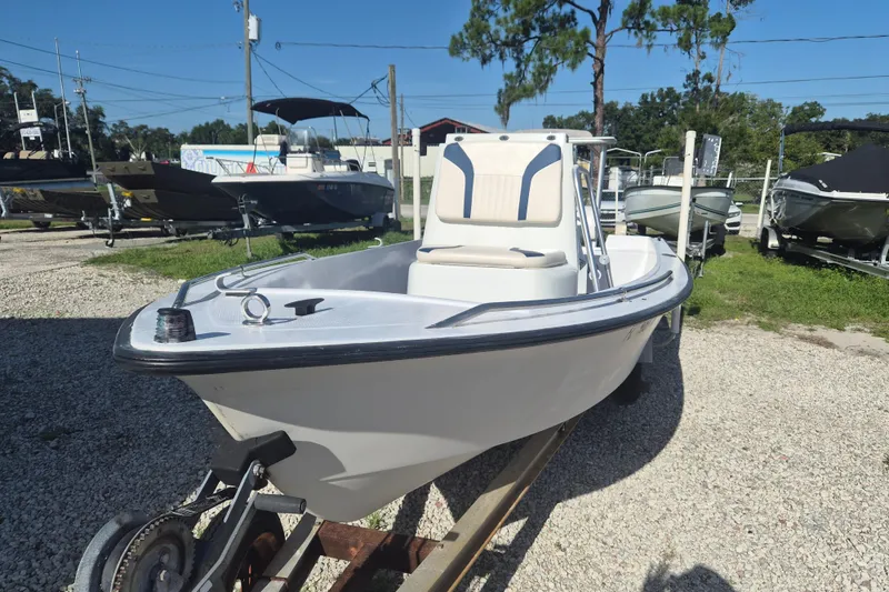 Slide: The Image of 1992 Key West 1720 Center Console boat on trailer in outdoor lot. - 16