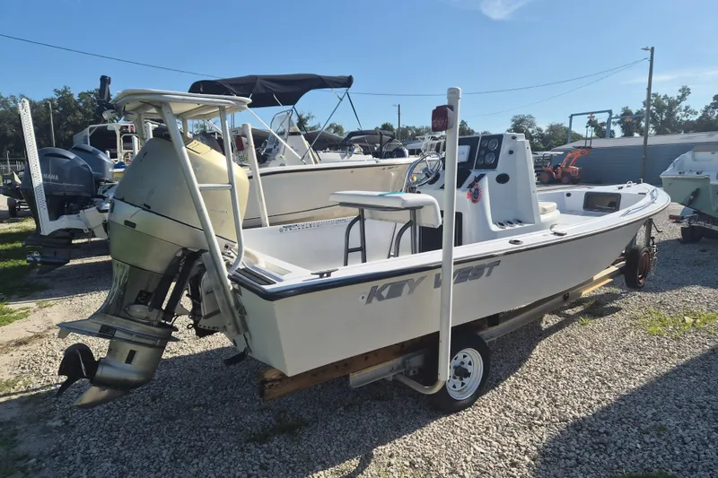 Slide: The Image of 1992 Key West 1720 Center Console boat with outboard motor on a trailer. - 2