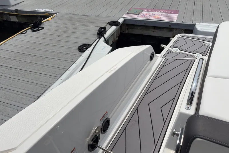 Slide: The Image of 2023 Monterey 298SS Super Sport boat docked, showcasing sleek design and modern detailing. - 30