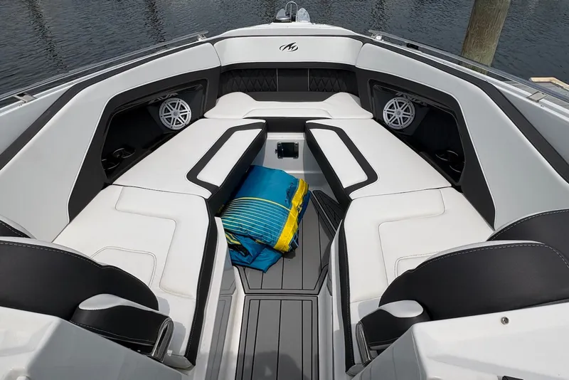 Slide: The Image of 2023 Monterey 298SS Super Sport boat interior with white seating and colorful towels. - 21