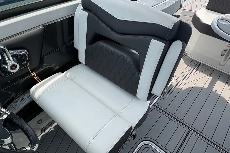 Slide: The Image of 2023 Monterey 298SS Super Sport boat interior with sleek seating and modern controls. - 18