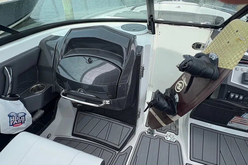 Slide: The Image of Interior of 2023 Monterey 298SS Super Sport boat with wakeboard and sleek design. - 14