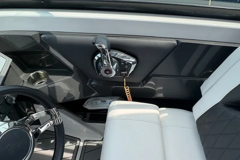 Slide: The Image of Interior of 2023 Monterey 298SS Super Sport boat with steering wheel and throttle controls. - 17