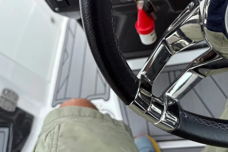 Slide: The Image of Steering wheel of 2023 Monterey 298SS Super Sport boat with modern design elements. - 29