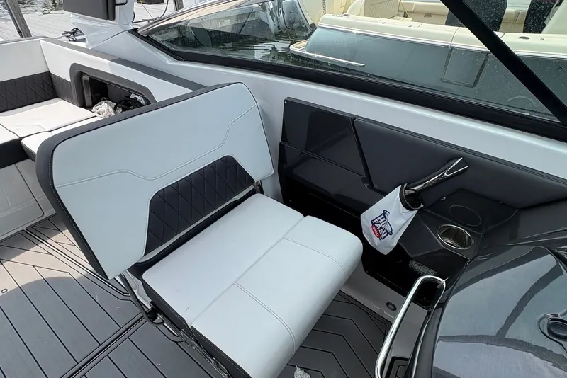 Slide: The Image of 2023 Monterey 298SS Super Sport boat interior with sleek seating and modern design. - 13