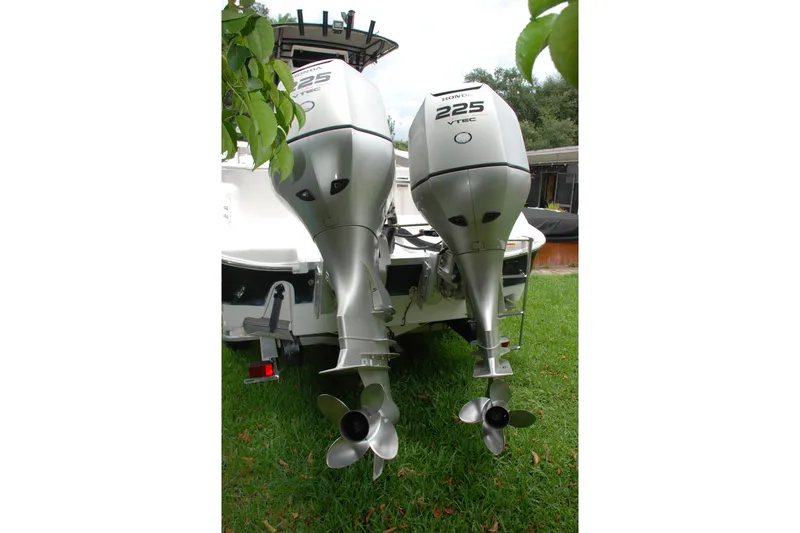 Slide: The Image of Twin Honda 225 VTEC outboard motors on a 2014 Scarab 255 boat. - 23