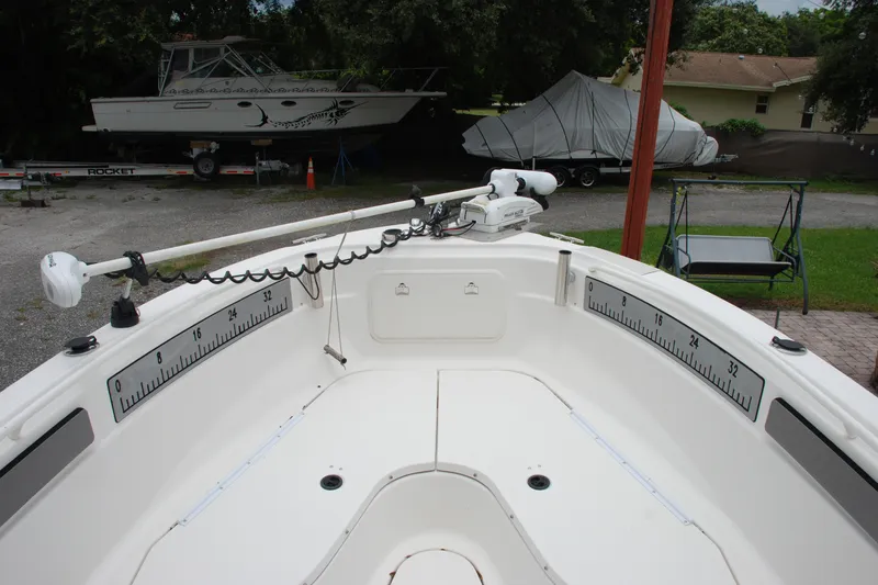 Slide: The Image of 2014 Scarab 255 boat interior with measuring scales and trolling motor. - 17