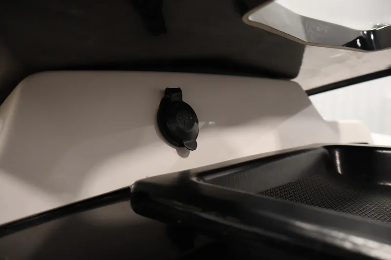 Slide: The Image of 12V outlet on 2017 Scarab 165 G boat interior. - 22
