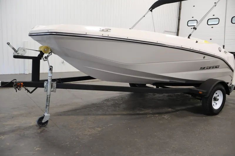 Slide: The Image of 2017 Scarab 165 G boat on trailer in indoor setting. - 31