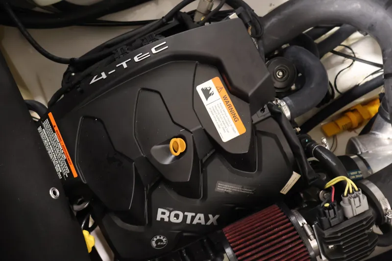 Slide: The Image of Engine of 2017 Scarab 165 G with Rotax 4-TEC technology, featuring warning label. - 25