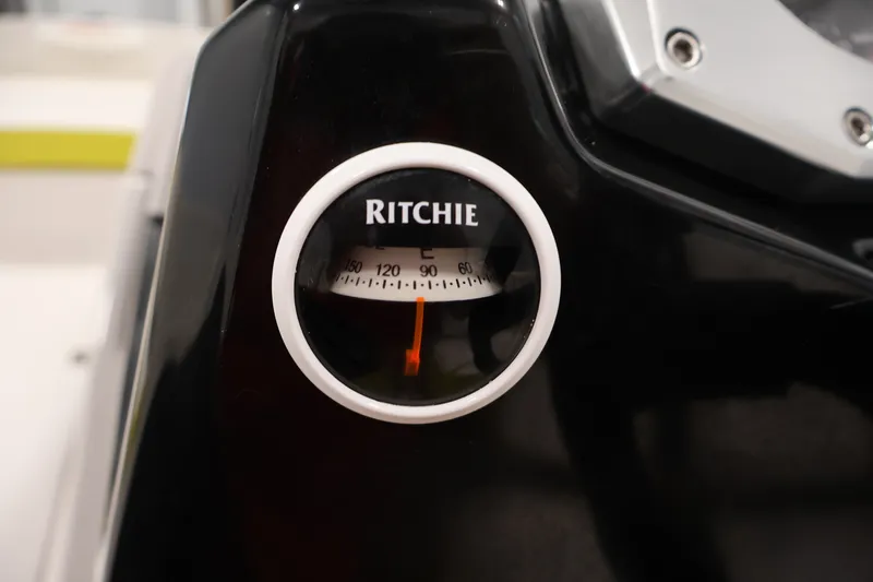 Slide: The Image of Compass on 2017 Scarab 165 G boat dashboard, featuring Ritchie branding. - 19