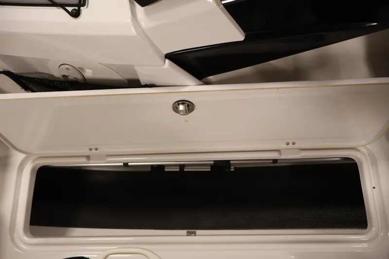 Slide: The Image of Open storage compartment in 2017 Scarab 165 G boat, showcasing interior space. - 15