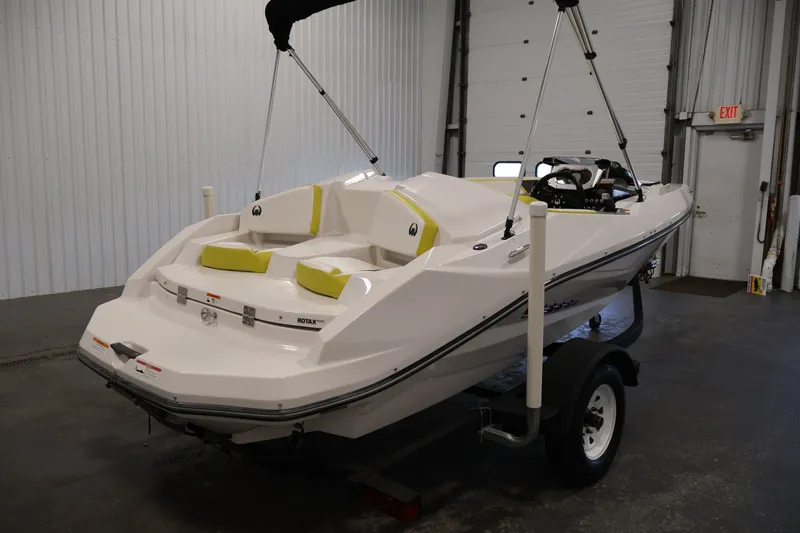 Slide: The Image of 2017 Scarab 165 G boat on trailer in indoor storage facility. - 5