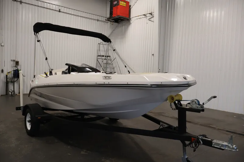 Slide: The Image of 2017 Scarab 165 G boat on trailer in indoor storage facility. - 3