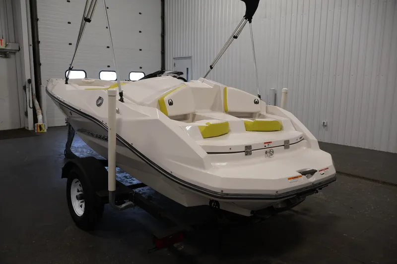 Slide: The Image of 2017 Scarab 165 G boat on trailer in indoor storage facility. - 7