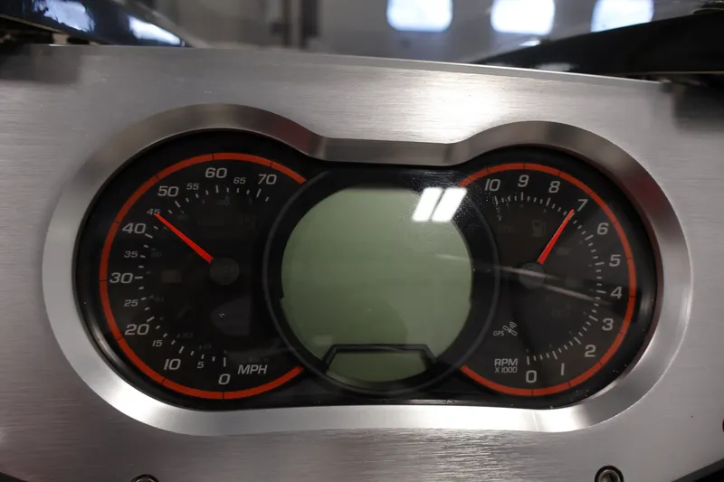 Slide: The Image of Dashboard of a 2017 Scarab 165 G boat, featuring speedometer and tachometer gauges. - 18
