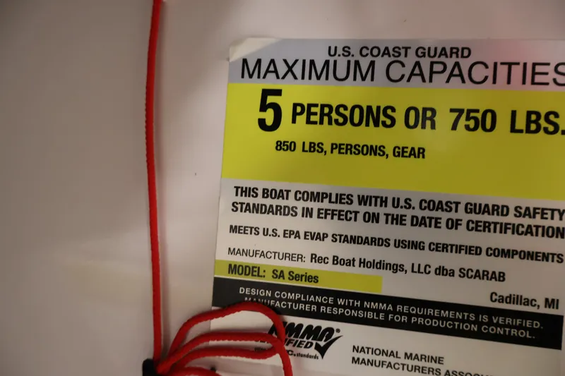 Slide: The Image of U.S. Coast Guard capacity label for 2017 Scarab 165 G boat, 5 persons or 750 lbs. - 21