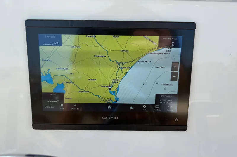 Slide: The Image of Garmin GPS display on 2027 Pioneer 222 Islander boat, showing coastal navigation map. - 17