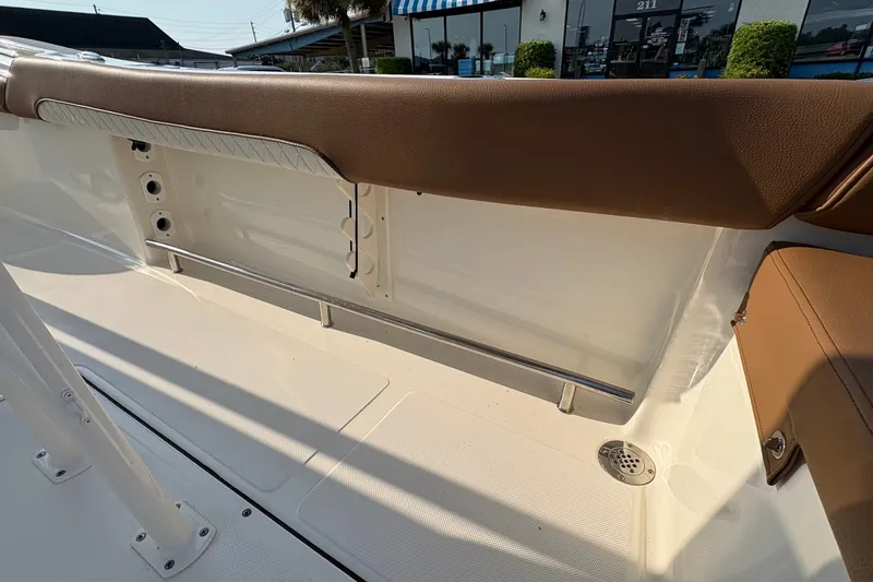 Slide: The Image of Interior view of 2027 Pioneer 222 Islander boat, featuring sleek seating and modern design elements. - 19