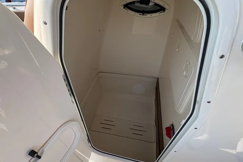 Slide: The Image of Interior cabin of 2027 Pioneer 222 Islander boat, featuring a compact, clean design. - 22