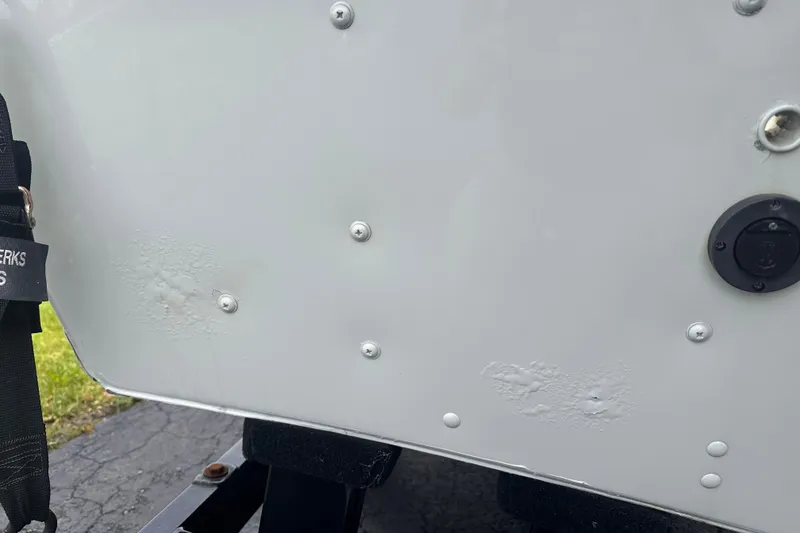 Slide: The Image of 2013 Alumacraft Competitor 185 Sport boat hull with visible wear and rivets. - 30