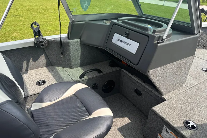 Slide: The Image of 2013 Alumacraft Competitor 185 Sport interior with seating and storage compartments. - 17