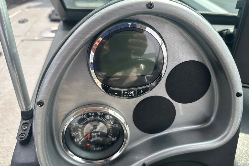 Slide: The Image of Dashboard of 2013 Alumacraft Competitor 185 Sport boat with speedometer and controls. - 16