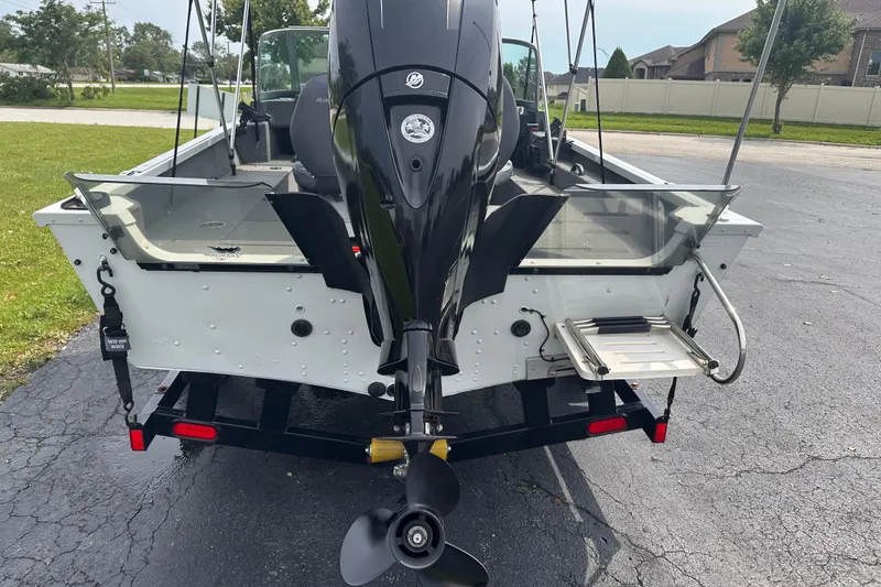 Slide: The Image of 2013 Alumacraft Competitor 185 Sport boat with outboard motor and swim platform. - 4