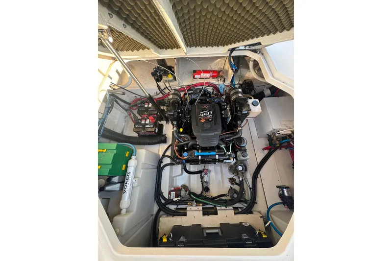 Slide: The Image of Engine compartment of a 2006 Searay 260 boat, showcasing detailed mechanical components. - 22