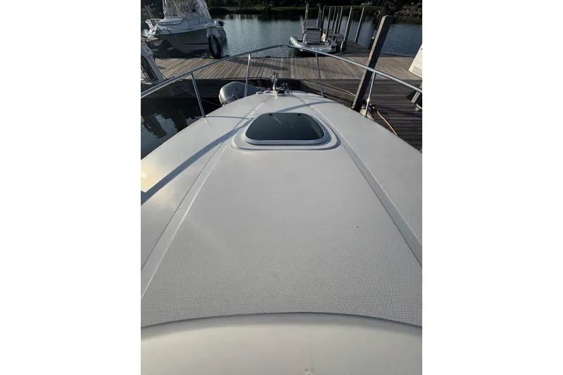 Slide: The Image of 2006 Sea Ray 270 Sundancer boat deck view at marina. - 8