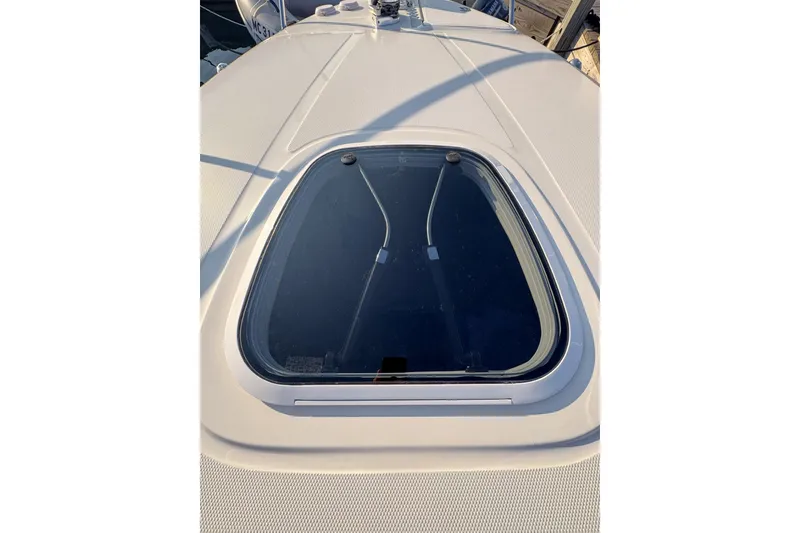 Slide: The Image of 2006 Sea Ray 270 Sundancer boat deck with a closed hatch window. - 36