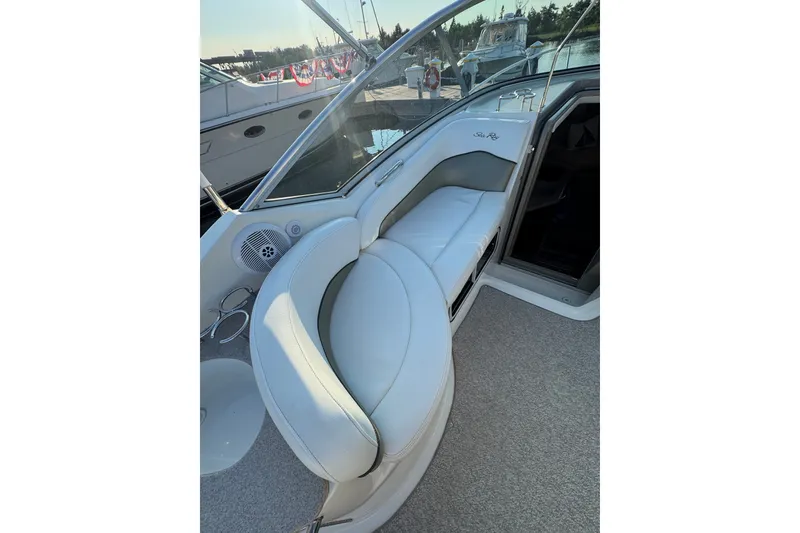 Slide: The Image of 2006 Searay 260 boat interior with white seating and modern design. - 20