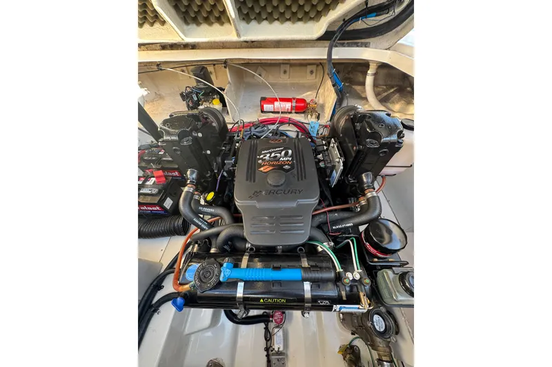 Slide: The Image of Engine compartment of a 2006 Searay 260 boat, featuring a Mercury 350 MPI engine. - 27