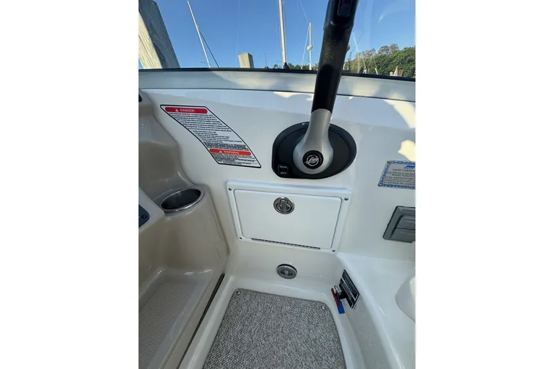 Slide: The Image of Control panel of a 2006 Sea Ray 270 Sundancer boat with throttle lever. - 11