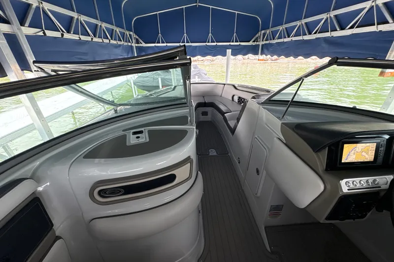 Slide: The Image of Interior view of a 2021 Crownline 290 SS boat with navigation system. - 20