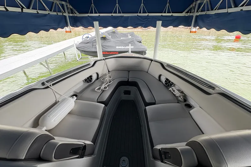 Slide: The Image of Interior of a 2021 Crownline 290 SS boat with spacious seating and lake view. - 23