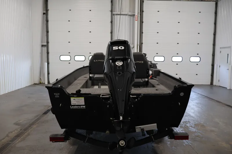 Slide: The Image of 2020 Lund 1650 Angler SS boat with 50 HP motor in a garage setting. - 6