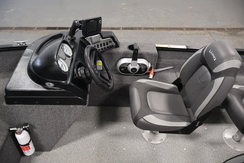 Slide: The Image of 2020 Lund 1650 Angler SS boat interior with steering console and seating. - 22