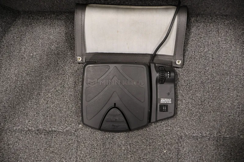 Slide: The Image of Minn Kota foot pedal on 2020 Lund 1650 Angler SS boat, carpeted floor. - 14