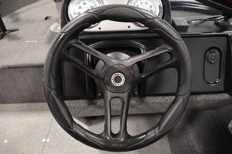 Slide: The Image of Steering wheel of 2020 Lund 1650 Angler SS boat with dashboard gauges. - 24