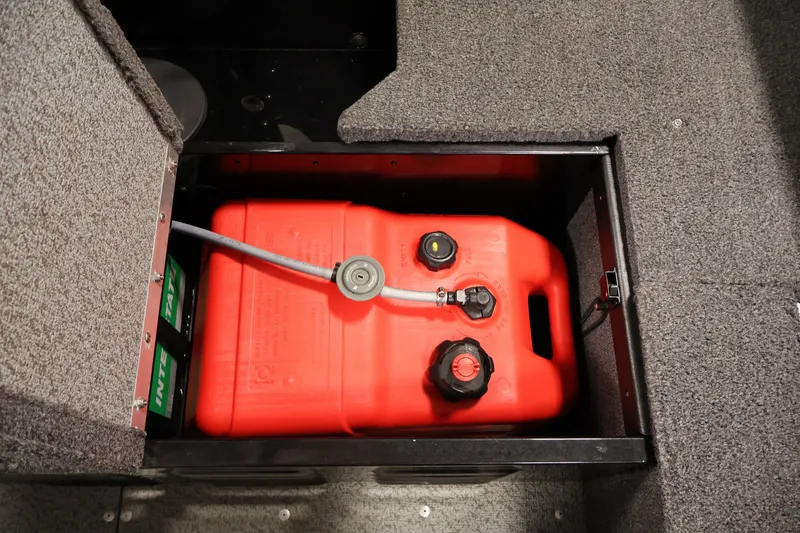 Slide: The Image of 2020 Lund 1650 Angler SS boat fuel tank compartment with red fuel container. - 33