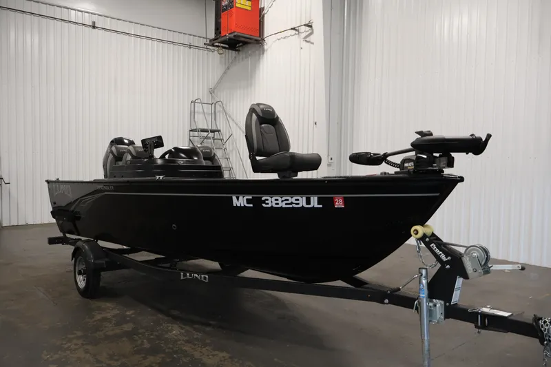 Slide: The Image of 2020 Lund 1650 Angler SS fishing boat on trailer in indoor storage. - 3