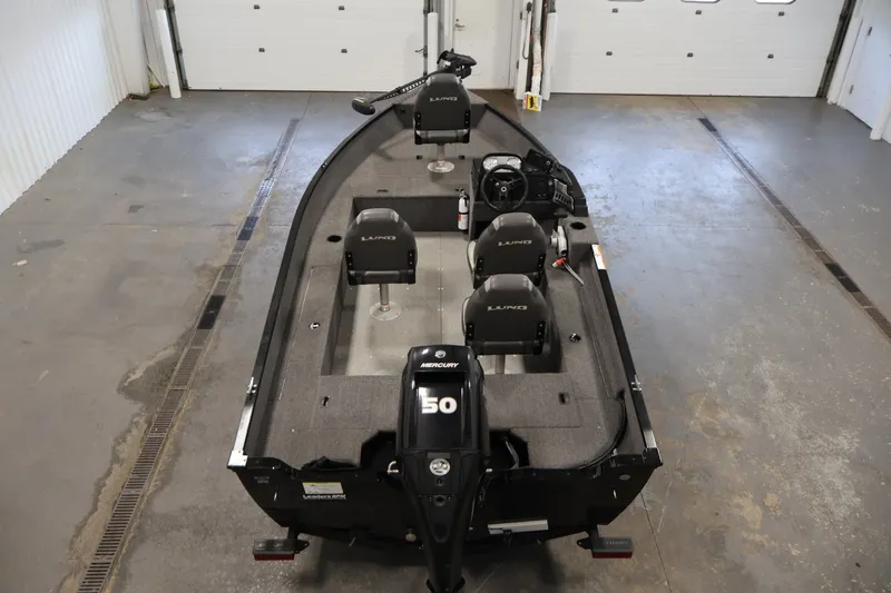 Slide: The Image of 2020 Lund 1650 Angler SS fishing boat with Mercury 50 engine in a garage. - 10