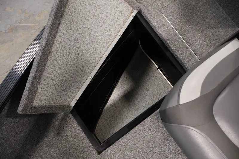Slide: The Image of Open storage compartment in 2020 Lund 1650 Angler SS boat interior. - 16